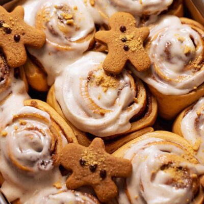 Gingerbread cinnamon rolls with icing and gingerbread cookies for Foodie Kids Merry & Bright Bake Shop camp.